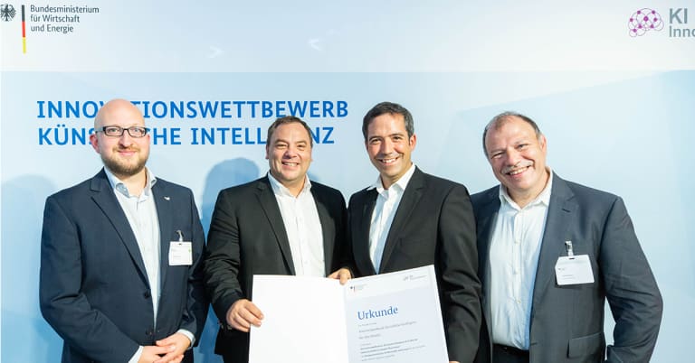 Überreichung der Urkunde an Vertreter des K4R-Konsotiums